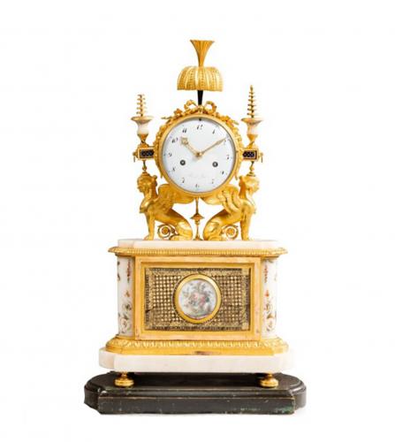A late Louis XVI verre églomisé mantel clock