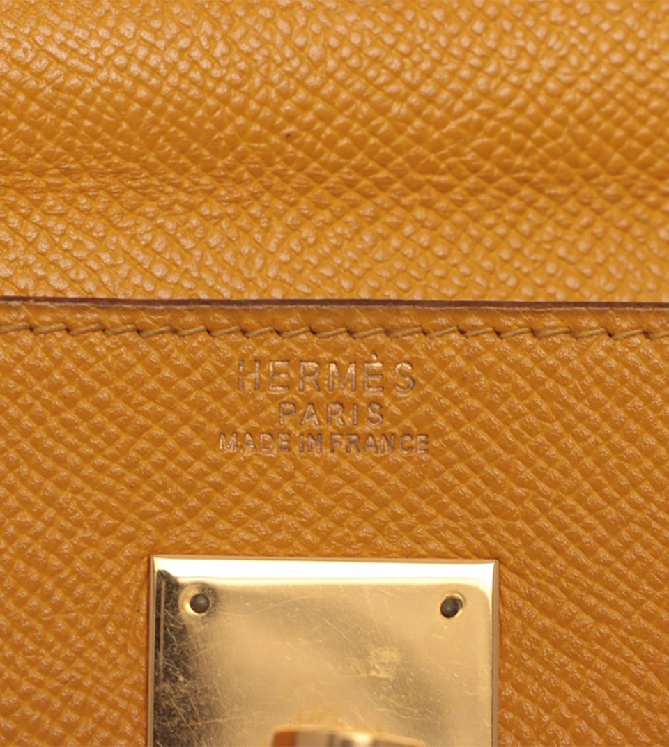 A JAUNE COURCHEVEL LEATHER RETOURNÉ KELLY 32 WITH GOLD HARDWARE